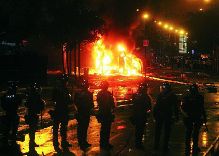 The scene in Little India as vehicles burn during the riots that broke out, December 8, 2013. u00e2u20acu201d Today pic