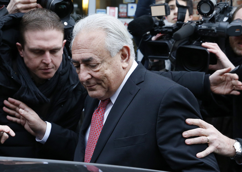 Dominique Strauss-Kahn, surrounded by journalists, enters his car as he leaves his hotel to attend trial, in Lille, February 12, 2015. u00e2u20acu201d Reuters pic
