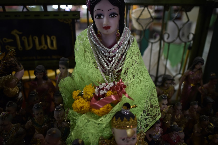 This picture taken on January 15, 2015 shows a statue of the famous ghost 'Nak', a woman who Thais believe lived in the nineteenth century and died during childbirth, at her shrine sheltered in a Buddhist temple in Bangkok. u00e2u20acu201d AFP pic
