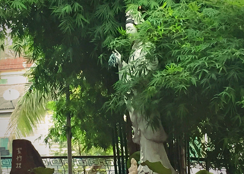 A status of the goddess of mercy, Kuan Yin is seen among foliage at a temple ground. u00e2u20acu201d Picture by Erna Mahyuni