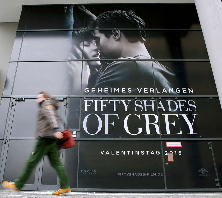 A pedestrian walks past an advertising placard for the movie 'Fifty Shades of Grey' at the upcomming 65th Berlinale International Film Festival February 4, 2015. u00e2u20acu201d Reuters pic