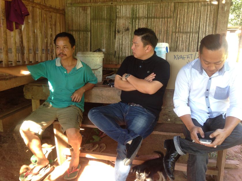 Penampang MP Darell Leiking (centre) and village security and safety development commitee chairman Michael Frederick (right) paid a visit to 46-year-old rubber tapper Jilius Yapoou00e2u20acu2122s home. u00e2u20acu201d Picture by Julia Chan