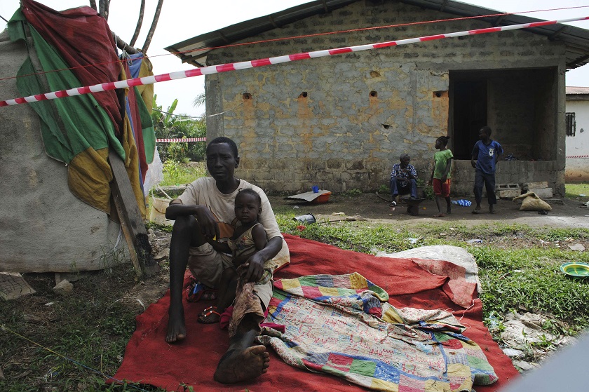 Suspected carrier of Ebola virus James Flomo sits in isolation with his children after his wife Lorpu Flomo died three days earlier in Monrovia, Liberia, January 21, 2015. u00e2u20acu201d Reuters pic