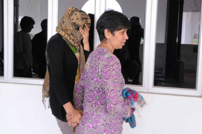 Nirmala Thapa (left) leaving the court in Bukit Mertajam, February 26, 2015. u00e2u20acu201d Picture by K.E. Ooi