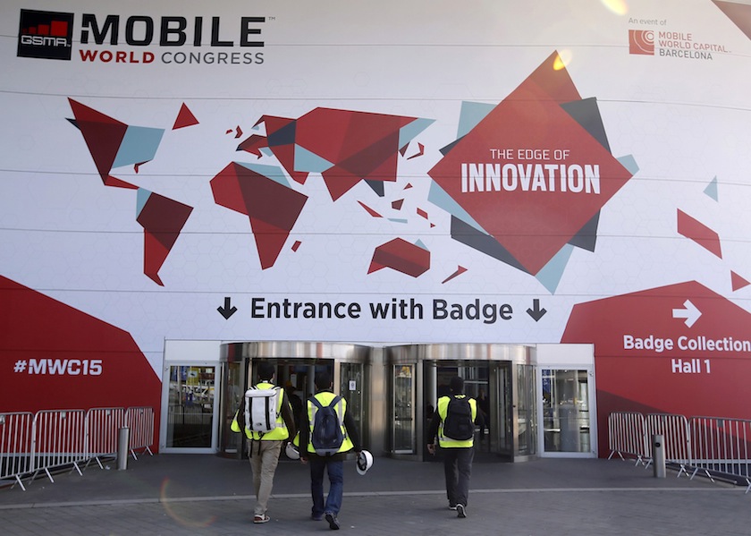 Workers walk to the entrance of the Mobile World Congress in Barcelona February 27, 2015. The GSMA Mobile World Congress, representing the interests of the worldwide mobile communications industry, will take place from March 2 to 5 in Barcelona.u00c2u00a0u00e2u20acu201d Reut