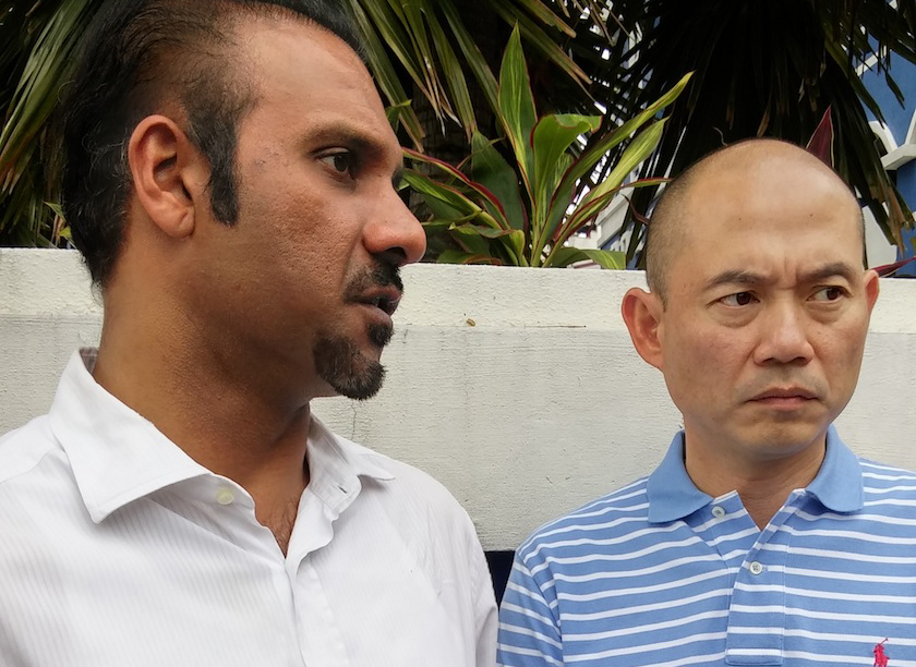 Ram Karpal and Lim speaking to reporters after lodging the police report at the Dang Wangi district police headquarters. u00e2u20acu201d Picture by Yiswaree Palansamy