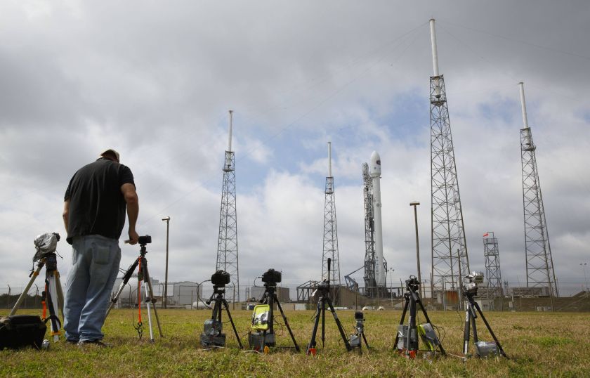 A photographer sets up a remote camera near the unmanned SpaceX Falcon 9 rocket, carrying NOAA's Deep Space Climate Observatory Satellite, at launch pad 40 at the Cape Canaveral Air Force Station in Cape Canaveral, Florida February 11, 2015. u00e2u20acu201d Reuters p