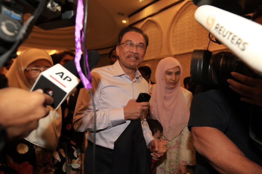 Anwar Ibrahim and his daughter Nurul Izzah Anwar arrives at the Palace of Justice in Putrajaya, February 10, 2015. u00e2u20acu2022 Picture by Choo Choy May
