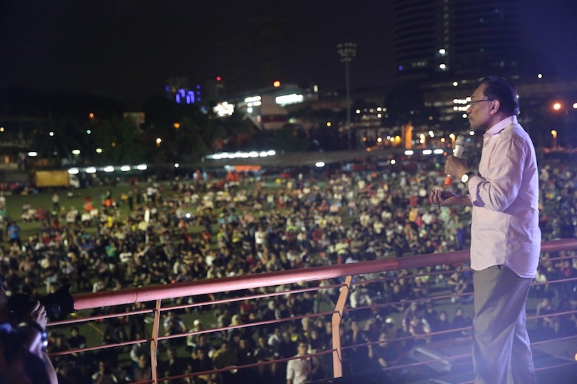 Anwar gesturing to the crowd during a rally February 9, 2015. u00e2u20acu201d Picture by Cho Choy May