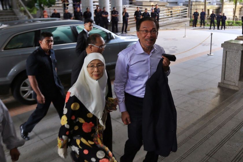 Datuk Seri Anwar Ibrahim (right) arrives at the Palace of Justice in Putrajaya, February 10, 2015. u00e2u20acu2022 Picture by Saw Siow Feng
