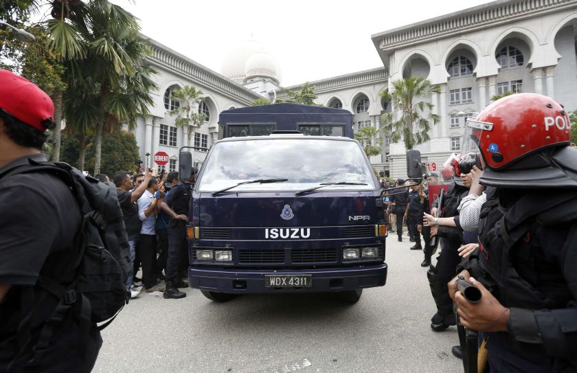A police van carrying Malaysian opposition leader Datuk Seri Anwar Ibrahim leaves the Federal Court in Putrajaya February 10, 2015. u00e2u20acu2022 Reuters pic