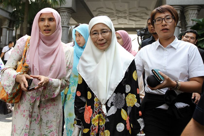 Datuk Seri Dr Wan Azizah Wan Ismail, her daughter Nurul Izzah Anwar (left) and Elizabeth Wong leave the court in Putrajaya February 10, 2015. u00e2u20acu201d Picture by Yusof Mat Isa 