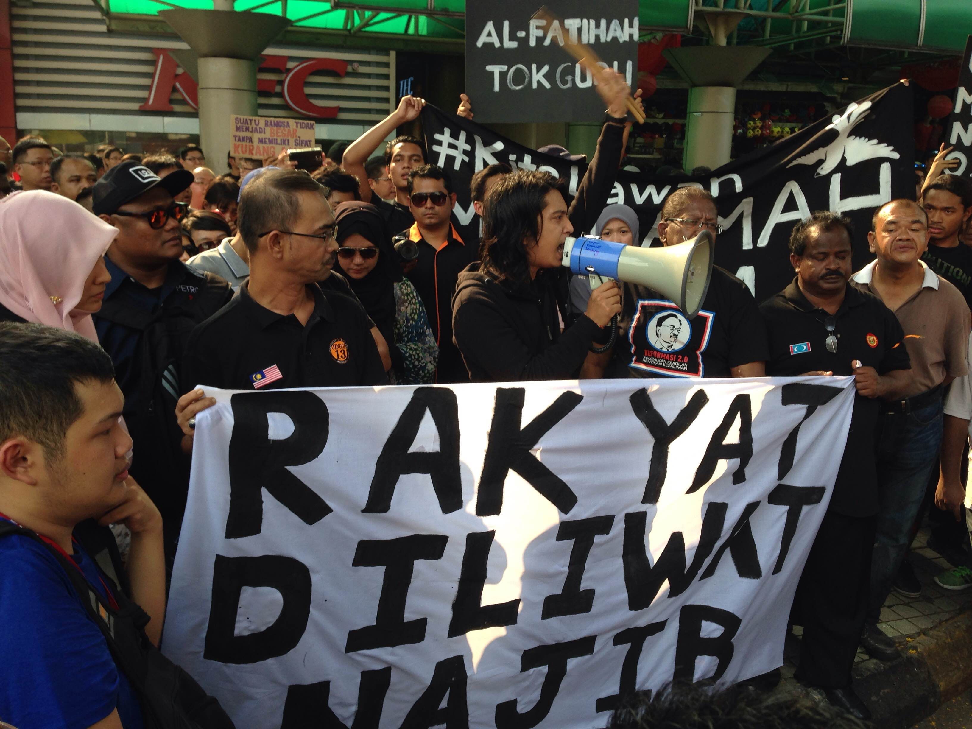 Youth activist Adam Adli Abdul Halim speak to supporters of Opposition Leader Datuk Seri Anwar Ibrahim during a rally against his imprisonment outside the Sogo shopping mall in Kuala Lumpur, February 14, 2015. ― Picture by Melissa Chi