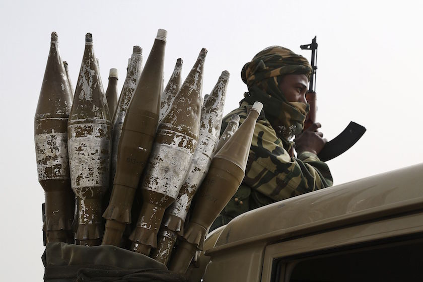 A Chadian soldier rides atop a pickup truck next to a bag of rocket-propelled grenades in Gambaru, Nigeria, February 26, 2015. u00e2u20acu201d Reuters pic