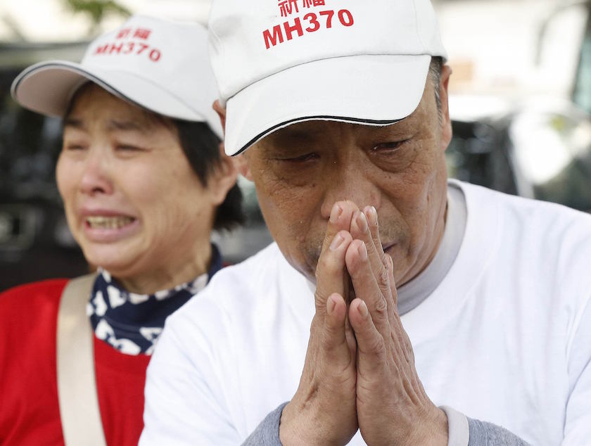 Relatives of passengers aboard missing Malaysia Airlines Flight MH370, thank members of the media outside the Malaysia Airlines headquarters in Kuala Lumpur February 12, 2015. u00e2u20acu201d Reuters pic
