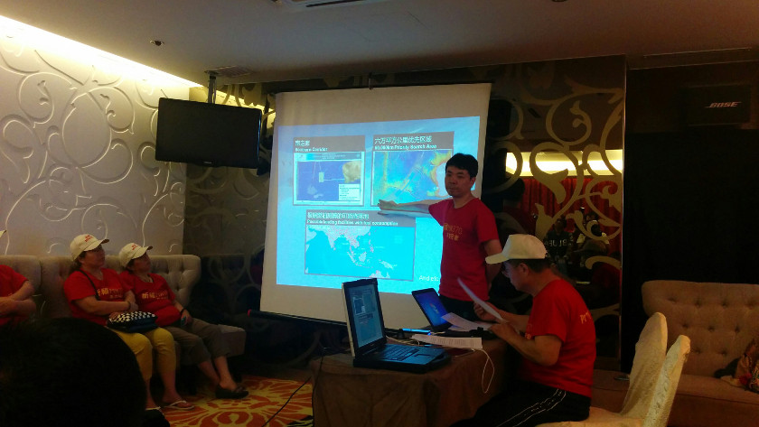 Flight MH370 next-of-kin spokesperson Jiang Hui from China (front) addresses the media using a slideshow at a press conference in Kuala Lumpur, on February 20, 2015. u00e2u20acu201d Picture by Mayuri Mei Lin