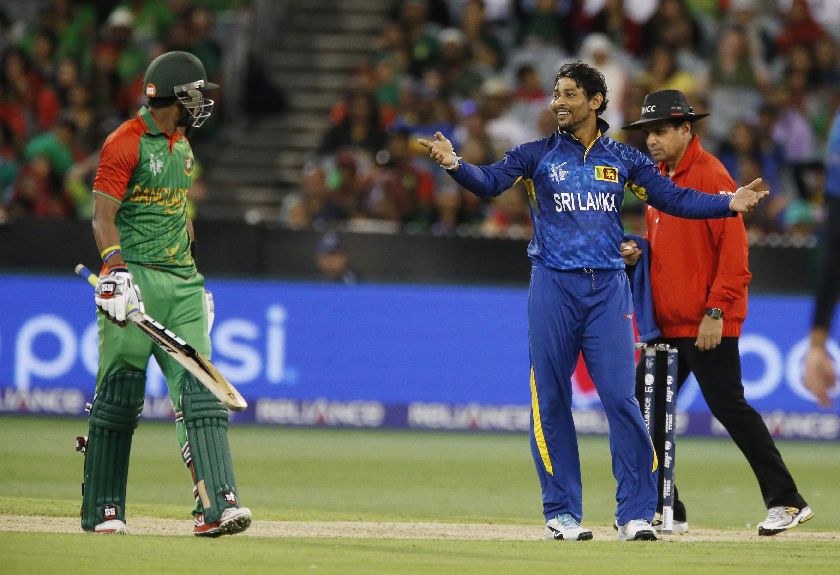 Sri Lanka bowler Tillakaratne Dilshan (R) celebrates after Bangladeshu00e2u20acu2122s batsman Mashrafe bin Mortaza (not in picture) was stumped as teammate Sabbir Rahman (L) is stranded Cricket World Cup MCG in Melbourne, February 26, 2015. REUTERS