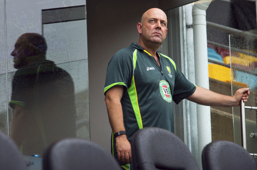 Australia's coach Darren Lehmann looks up at the sky as he stands on the balcony of the team dressing room before the scheduled start of the Cricket World Cup match between Australia and Bangladesh in Brisbane February 21, 2015. u00e2u20acu201d Reuters pic