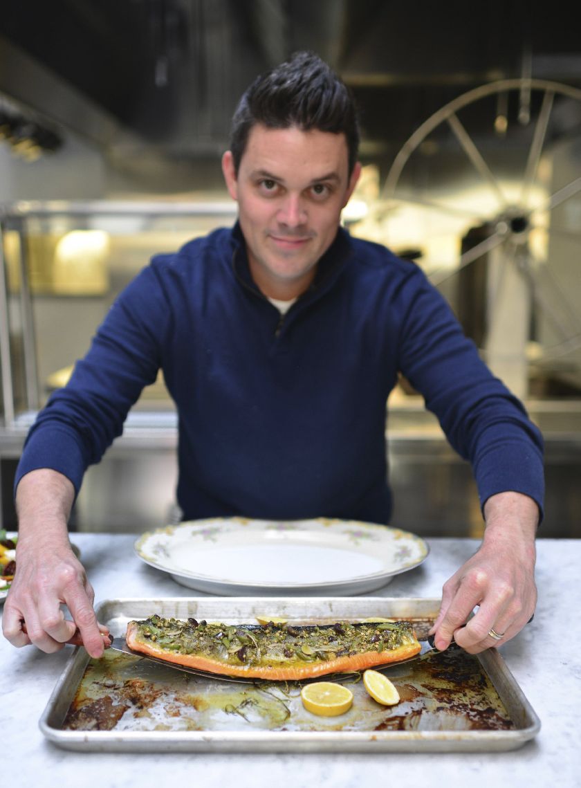 Gavin Kaysen with a prepared char in the kitchen.