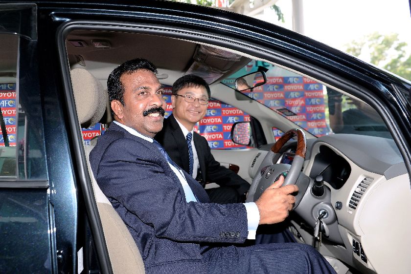 AFC secretary-general Datuk Alex Soosay (left) and Masanao Tomozoe , president of Toyota Motor Sales and Marketing Corporation , reviewing the Toyota Innova at AFC House in Bukit Jalil, February 27, 2015. u00e2u20acu201d fotoBERNAMA 