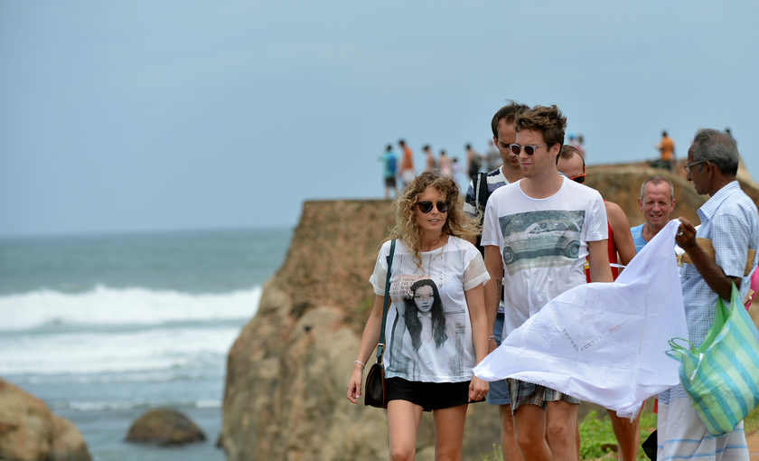 Foreign tourists at the Galle fort in Sri Lanka on August 4, 2014. A Dutch homeymooner was lucky to survive a fall off one of the country's best known tourist spots, the World's End cliff, February 21, 2015. u00e2u20acu201d AFP pic