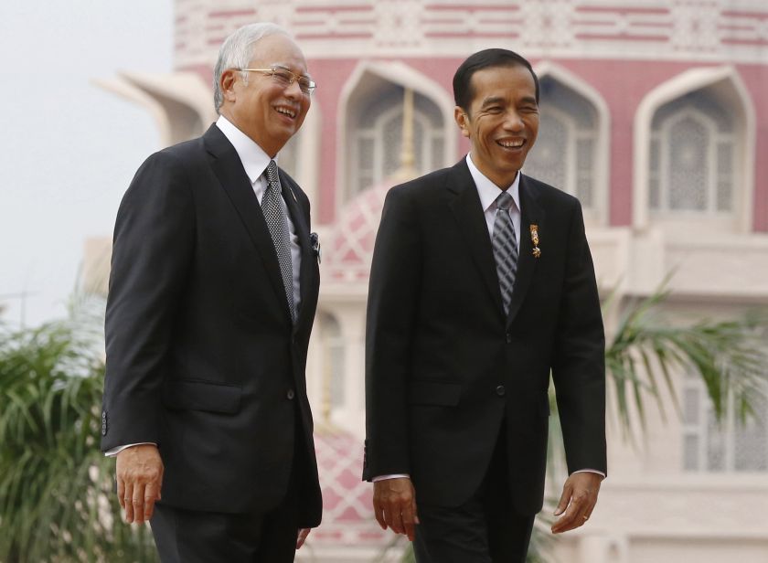 Malaysian Prime Minister Datuk Seri Najib Razak welcomes Indonesian President Joko Widodo (right) to the Prime Minister's Office in Putrajaya February 6, 2015. u00e2u20acu2022 Reuters pic