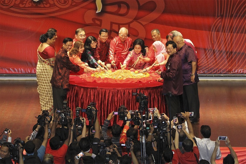 Datuk Seri Najib Razak, Tan Sri Muhyiddin Yassin, Datuk Seri Dr Liow Tiong Lai and their wives enjoying the yee sang at MCA's Chinese New Year Open House in Kuala Lumpur, Feb 19, 2015. u00e2u20acu201d Picture by Yusof Mat Isa 