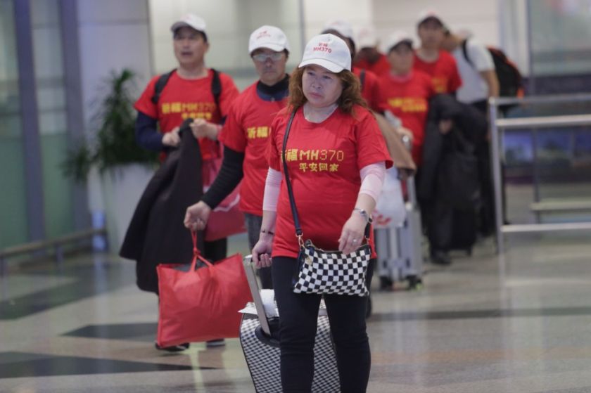 Families of MH370u00e2u20acu2122s Chinese victims arrive at the Kuala Lumpur International Airport, February 12, 2015. u00e2u20acu201d Pictures by Choo Choy May