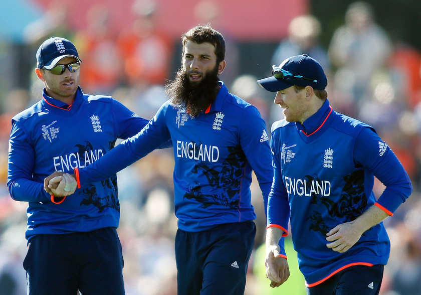 England's Moeen Ali (centre) celebrates with Ian Bell (left) and Eoin Morgan during their Cricket World Cup match in Christchurch, February 23, 2015. u00e2u20acu201d Reuters pic 