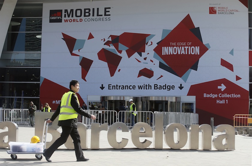 A worker pulls a trolley at the entrance of the Mobile World Congress in Barcelona February 27, 2015. u00e2u20acu201d Reuters pic