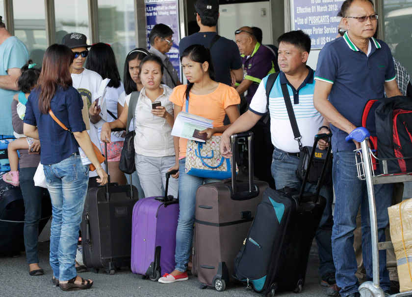 Overseas Filipino Workers (OFW) wait to board a flight in Manila January 12, 2015. The OFWs are a major contributor to the strong Philippine economy powering the stock market to an expected record high. u00e2u20acu201d Reuters pic
