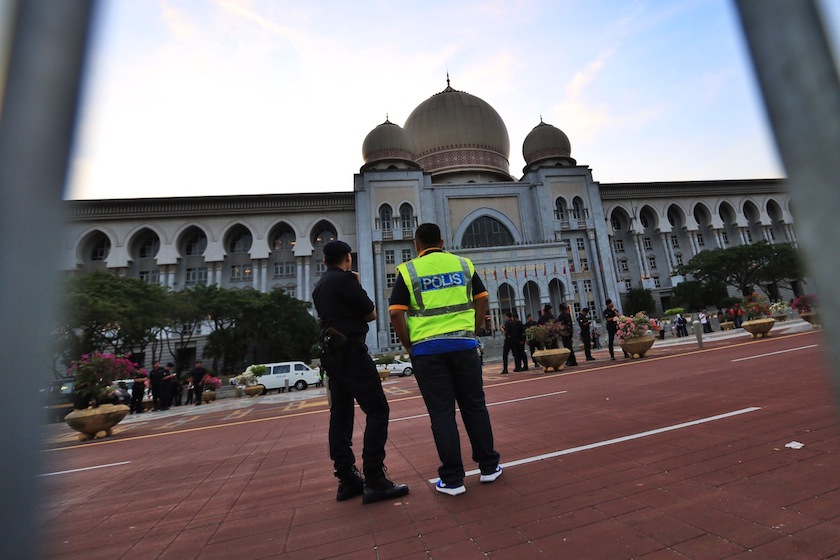 More than 150 police officers in riot gear began assembling shortly after dawn. u00e2u20acu201d Picture by Saw Siow Feng