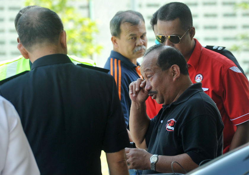 Highway patrolman Police Sergeant Sallehuddin Hassan, husband of murder victim Izaah Abdullah, is seen wiping away tears, surrounded by his colleagues at the Raja Permaisuri Bainun Hospital mortuary in Ipoh, February, 11, 2015. u00e2u20acu201d Bernama pic