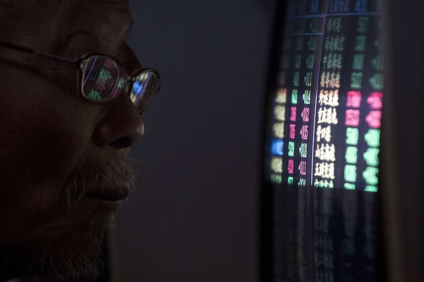 An investor looks at a computer screen showing stock information an a brokerage house in Shanghai, in this December 15, 2014 file photograph. u00e2u20acu201d Reuters pic