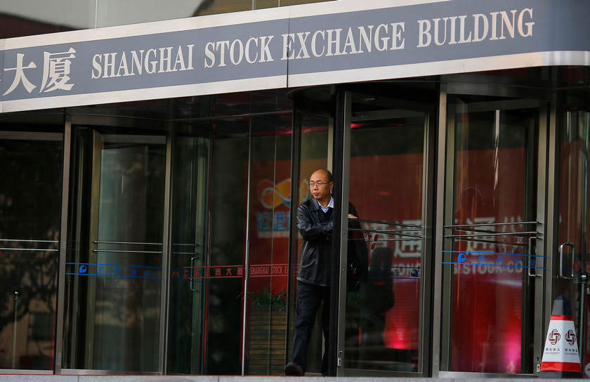 A man walks out of the Shanghai Stock Exchange building at the Pudong financial district in Shanghai November 17, 2014. The Shanghai Composite Index rose 0.8 per cent February 17, 2015. u00e2u20acu201d Reuters pic