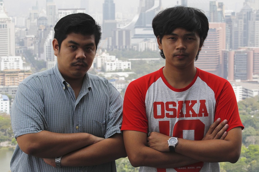 Thai student activists, Than Rittiphan (left) and Songtham Kaewpanpruek pose for photographs after an interview with Reuters in Bangkok, February 16, 2015.  u00e2u20acu201d Reuters pic