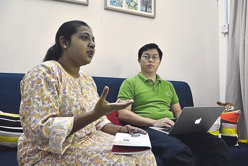 Yu (right) says the helpline was the most widespread service provided and it was currently being handled by the seven trained social workers like Yogasri. u00e2u20acu201d Picture by Shafiq Zain