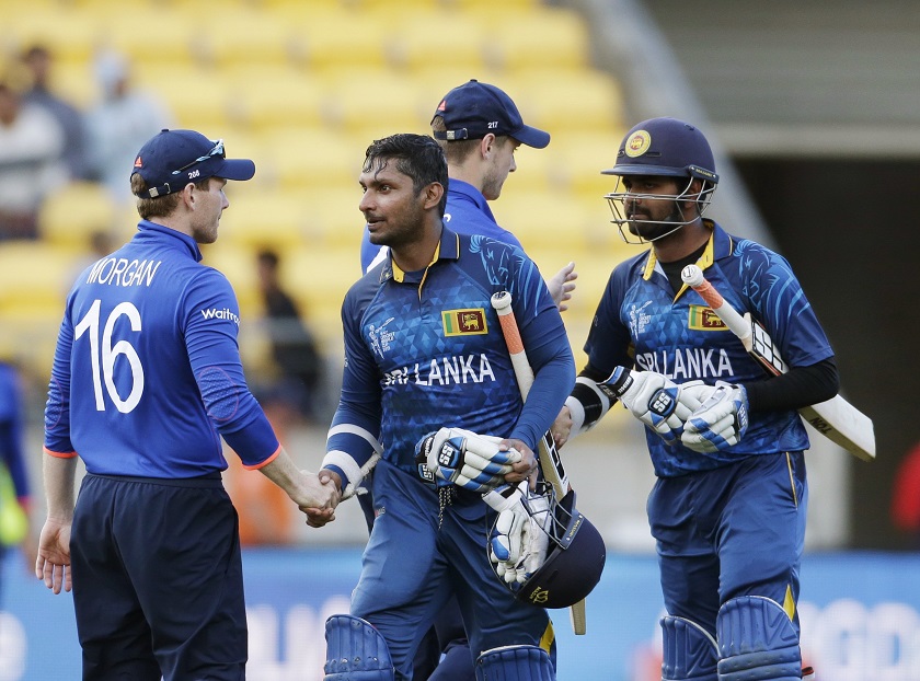 Sri Lankau00e2u20acu2122s Kumar Sangakkara (second from left) shakes hands with Englandu00e2u20acu2122s captain Eoin Morgan (left) as Lahiru Thirimanne (right) shakes hands with Chris Woakes after their Cricket World Cup match in Wellington, March 1, 2015. u00e2u20acu201d Reuters pic