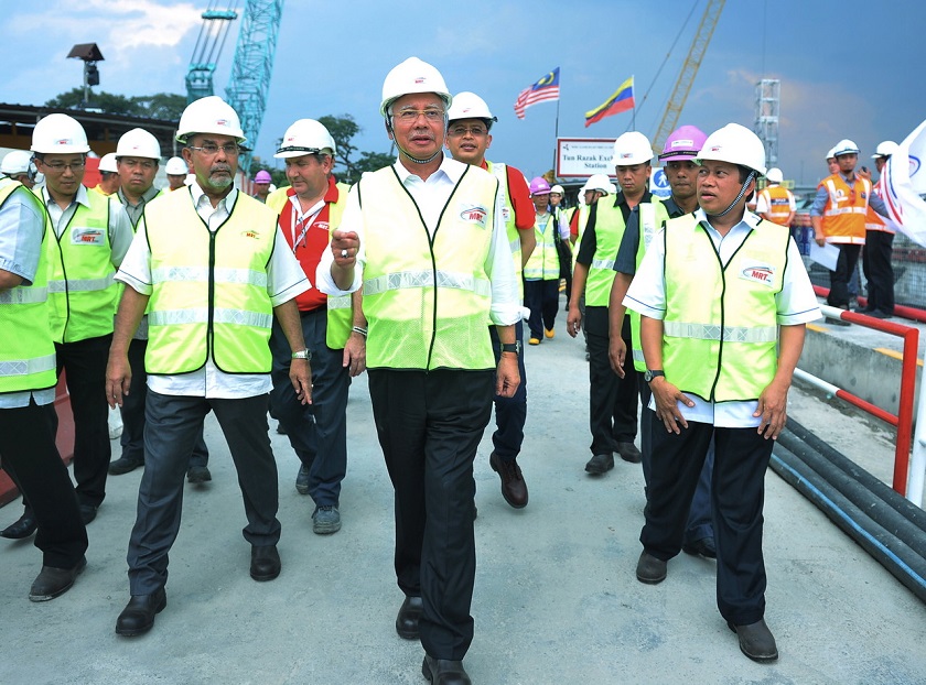 Prime Minister Datuk Seri Najib Razak (centre) visits the construction site of the Cochrane Mass Rapid Transit (MRT) station in Kuala Lumpur yesterday. Picture released March 4, 2015. u00e2u20acu201d Bernama pic
