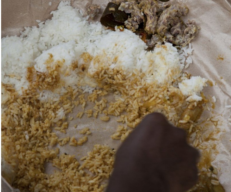 A construction worker having lunch by a building site in Singapore. u00e2u20acu201d TODAY/CARE pic