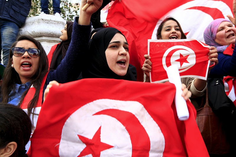 Tunisian protesters shout slogans as they wave their national flag during a demonstration in Tunis, March 20, 2015, during Independence Day celebrations marking the 59th anniversary of independence in Tunis. u00e2u20acu201d Reuters pic