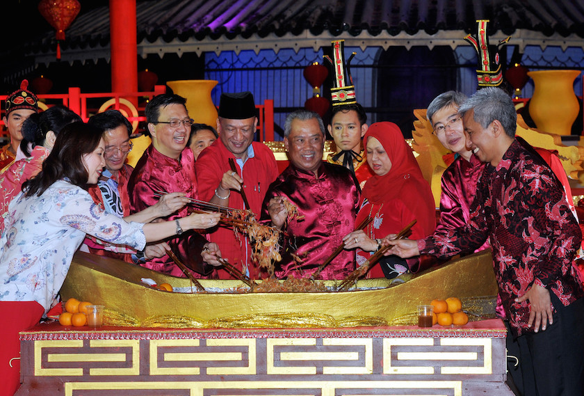 Deputy Prime Minister Tan Sri Muhyiddin Yassin and his wife Puan Sri Norainee Abdul Rahman toss yee sang during the Chinese New Year Open House at Dataran Menara Condong in Teluk Intan February 28, 2015. u00e2u20acu201d Bernama pic