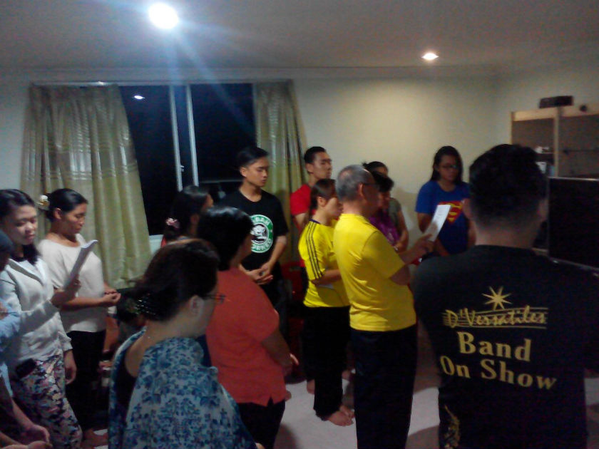 Worshippers pray before the figurine of the Virgin Mary, believed to have been shedding tears, at the owneru00e2u20acu2122s house in Kampung Mahandoi, near Penampang, Sabah. u00e2u20acu201d Pic courtesy of Terence Siambun