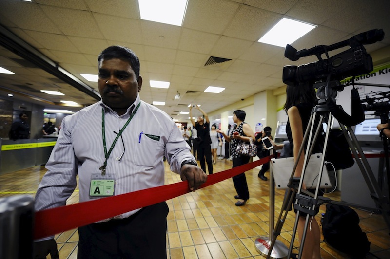A hospital staff cordons off an area for the media at the Singapore General Hospital, where Singapore's first Prime Minister Lee Kuan Yew is hospitalised at, in Singapore March 19, 2015.u00c2u00a0u00e2u20acu201d Reuters pic