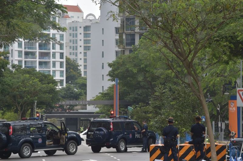 Singapore policemen block a road leading to the National University of Singapore where the funeral service for Singaporeu00e2u20acu2122s former prime minister Lee Kuan Yew will be held, March 29, 2015. u00e2u20acu201d AFP pic