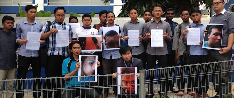(Fifth from the right) Mohd Ammar Atan and students posing in front of the Dang Wangi police headquarters after lodging a police report in Kuala Lumpur.