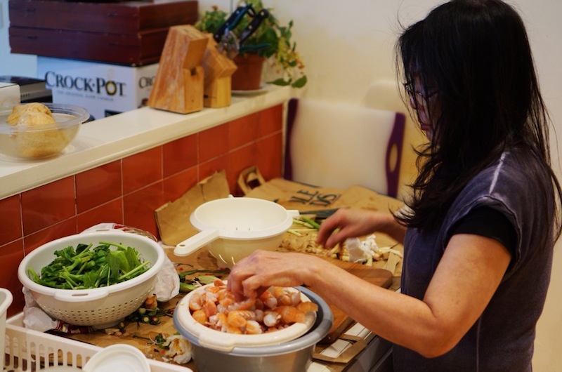 Pauline Chai preparing a meal for her family.