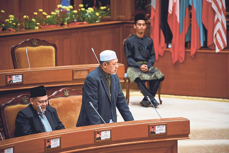 Kelantan Mentri Besar Datuk Ahmad Yaakob tables the hudud bill at the state assembly on Tuesday. Political analysts say those who support it are not well-informed while those who oppose are fixated on the punishments. u00e2u20acu2022 Malay Mail pic