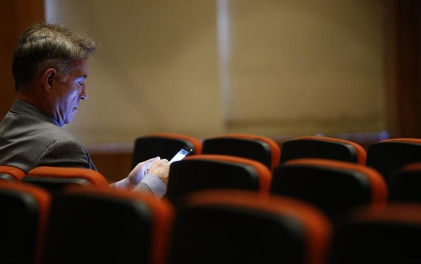 Brazilian tycoon Eike Batista checks his mobile phone before his court hearing in Rio de Janeiro November 18, 2014. u00e2u20acu201d Reuters pic