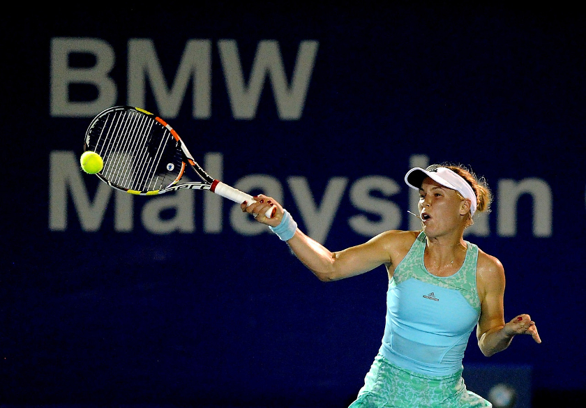 Top seed Caroline Wozniacki from Denmark returns a shot to Carina Witthoeft from Germany in the quarter-final rounds of the BMW Malaysian Open 2015 in Kuala Lumpur, March 6, 2015. u00e2u20acu201d Bernama pic